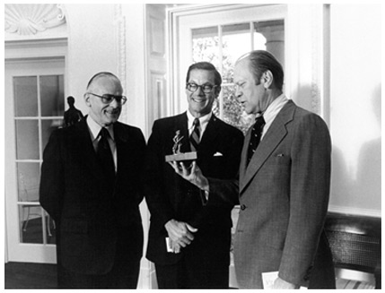 President Gerald Ford with a miniature Minute Man of Concord statue